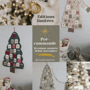Calendrier de l'avent décoratif en forme de sapin de Noël avec 24 petits compartiments numérotés.